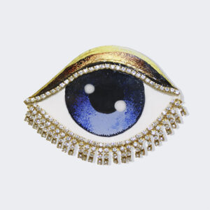 The eye has to travel blue brooch